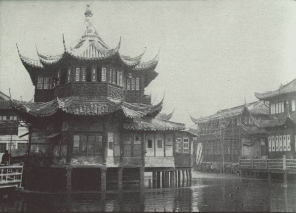 WILLOW PATTERN TEA HOUSE IN SHANGHAI

A famous landmark in the native city; said to be one of the oldest
tea-houses in China. Much business is transacted in these tea-houses all
over the country.