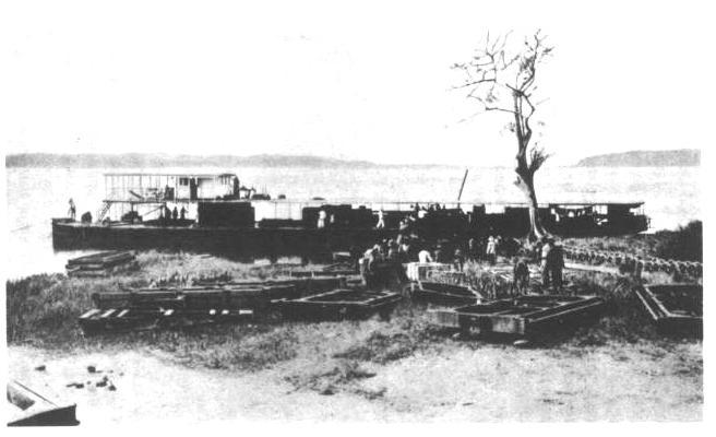 LOADING A BARGE.