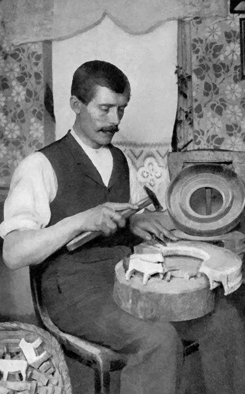 Toy-making in Germany.

How the rough figures are chipped from the wooden ring coming from the
cross-section of a tree.