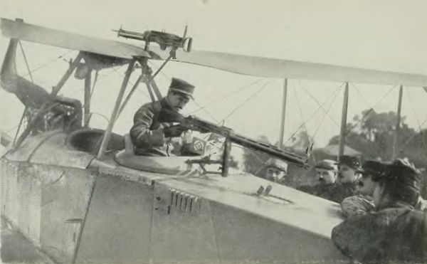 German Aeroplane Trophy--Jules Vedrine Examining the
Machine Gun