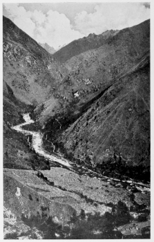 From the sugar cane, Urubanba Valley, at Colpani. On the
northeastern border of the Cordillera Vilcapampa looking upstream. In the
extreme background and thirteen sixteens of an inch from the top of the picture
is the sharp peak of Salcantay. Only the lower end of the more open portion
of the Canyon of Torontoy is here shown. There is a field of sugar cane in the
foreground and the valley trail is shown on the opposite side of the river.