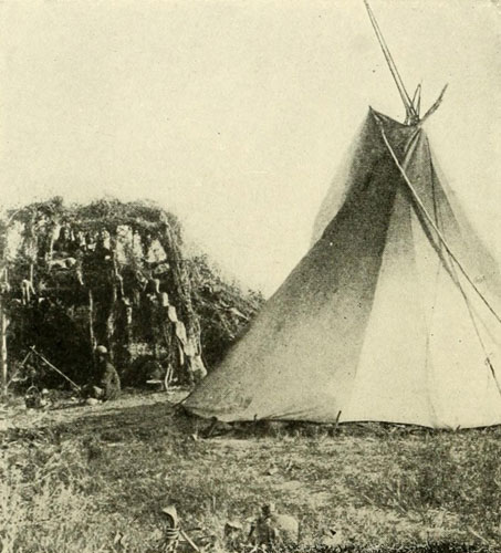 Uinte Ute Tipi and a
Summer Shelter and Outlook, Showing the Old-time Notched Log for a Ladder.