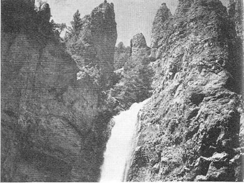 Rock pinnacles cluster around Tower Falls.